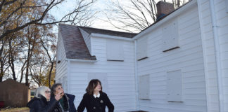 Town Supervisor Judi Bosworth, Marianna Wohlgemuth and Town Councilwoman Lee Seeman examine recently finished siding work on the Schumacher House.