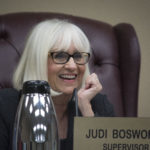Town Supervisor Judi Bosworth smiles as she addresses one of the commissioners present at a previous board meeting. (Photo by Janelle Clausen)