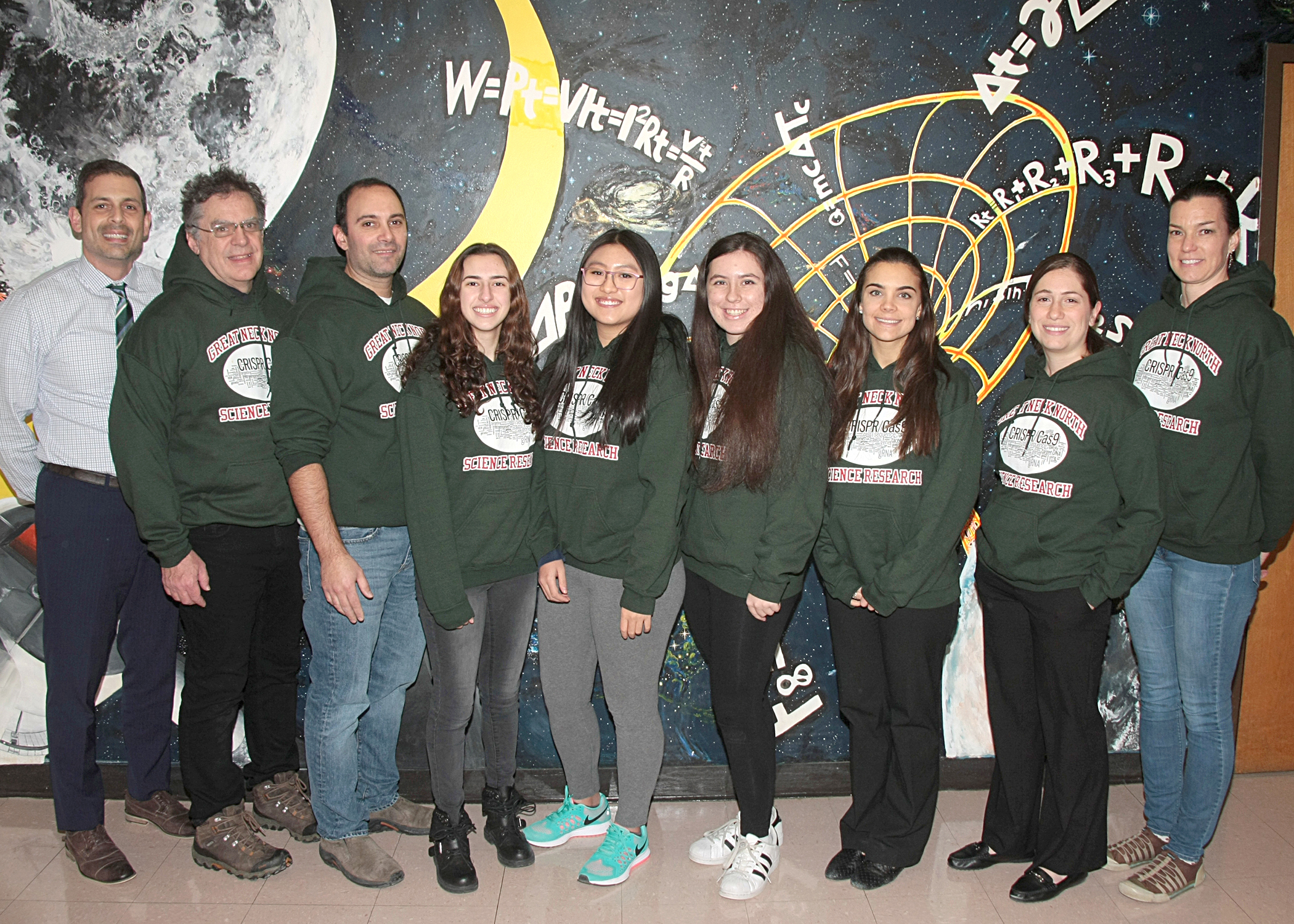 North High Regeneron Scholars Natasha Dilamani, Megan Xu and Amy Shteyman are joined by Principal Daniel Holtzman and science research teachers Alan Schorn, Christopher Bambino, Christina Keys and Maya Lerner, and Science Department Chair Jessica Schust. (Photo courtesy of the Great Neck Public Schools)