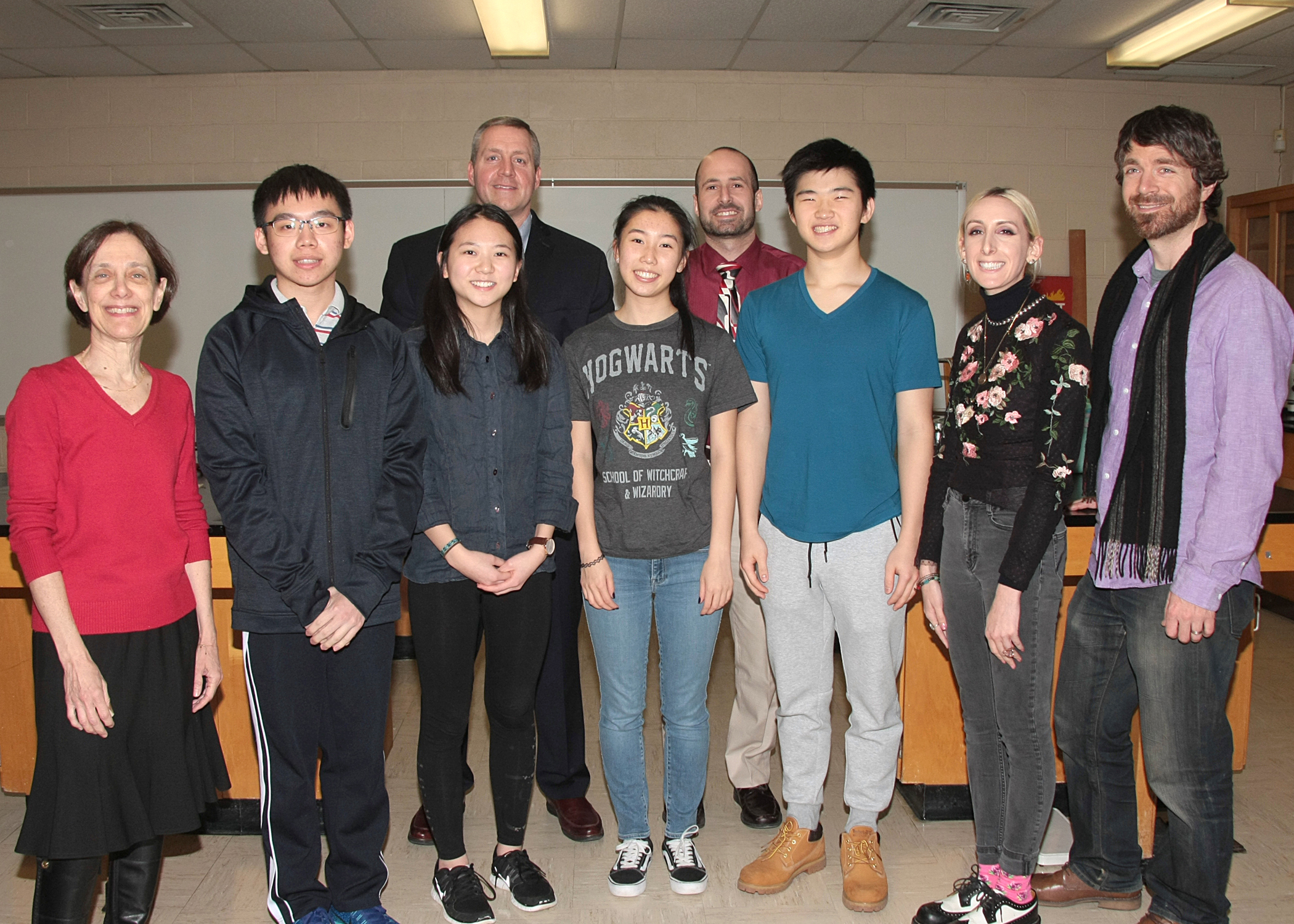 South High Regeneron Scholars Eric Kuang, Michelle Xing, Cindy Wang and Daniel Kim are joined by science research teacher Dr. Carol Hersh, Principal Dr. Christopher Gitz, Science Department Chair Bradley Krauz, and science research teachers Nicole Spanelli and Dr. James Truglio. (Photo courtesy of the Great Neck Public Schools)