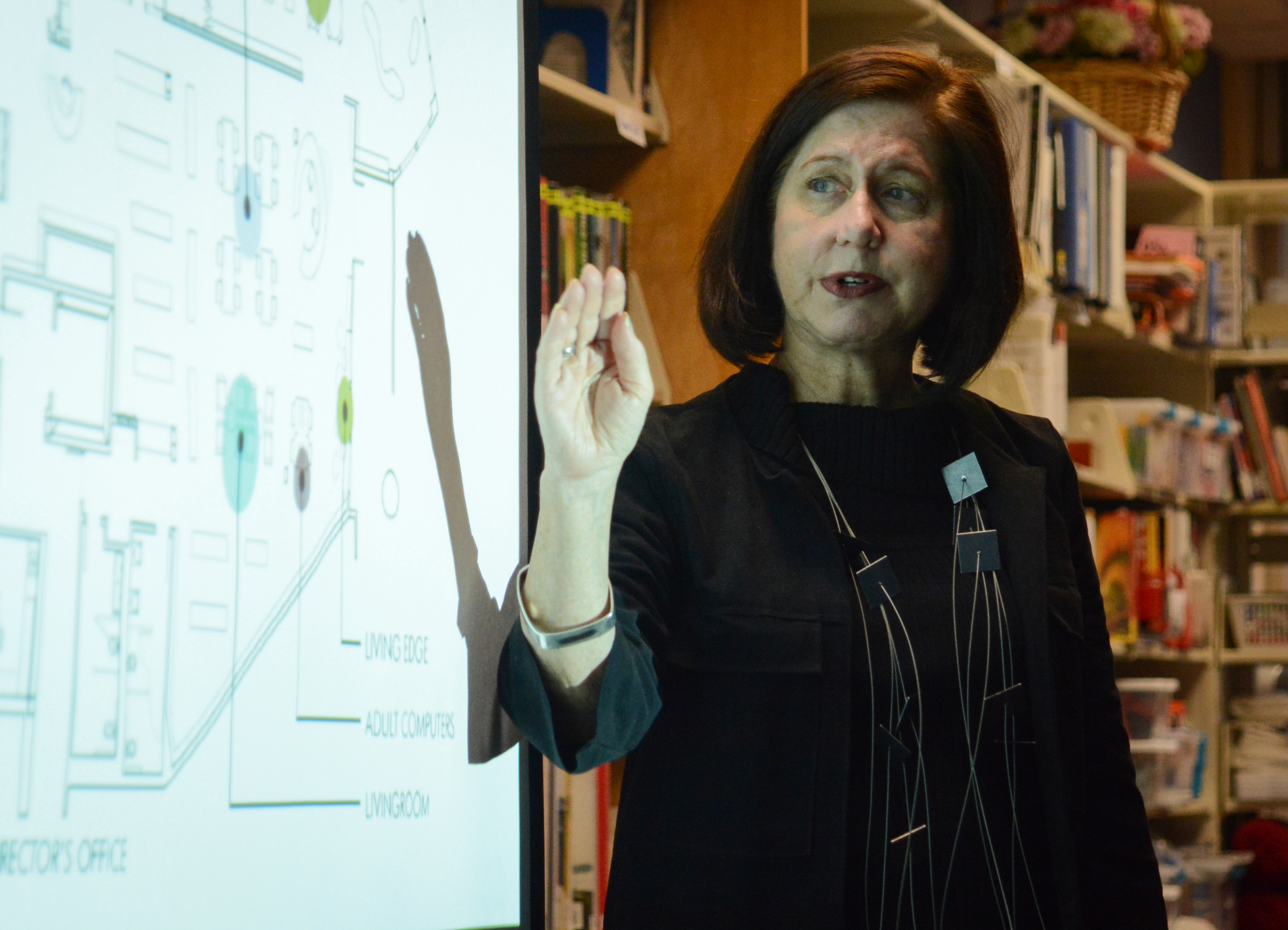 Elisabeth Martin, a principal at the architectural firm MDA designgroup, explains parts of a draft plan for Station Branch. (Photo by Janelle Clausen)