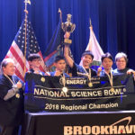 The South Middle team holds their Regional Science Bowl banner and trophy. (Photo courtesy of the Great Neck Public Schools)