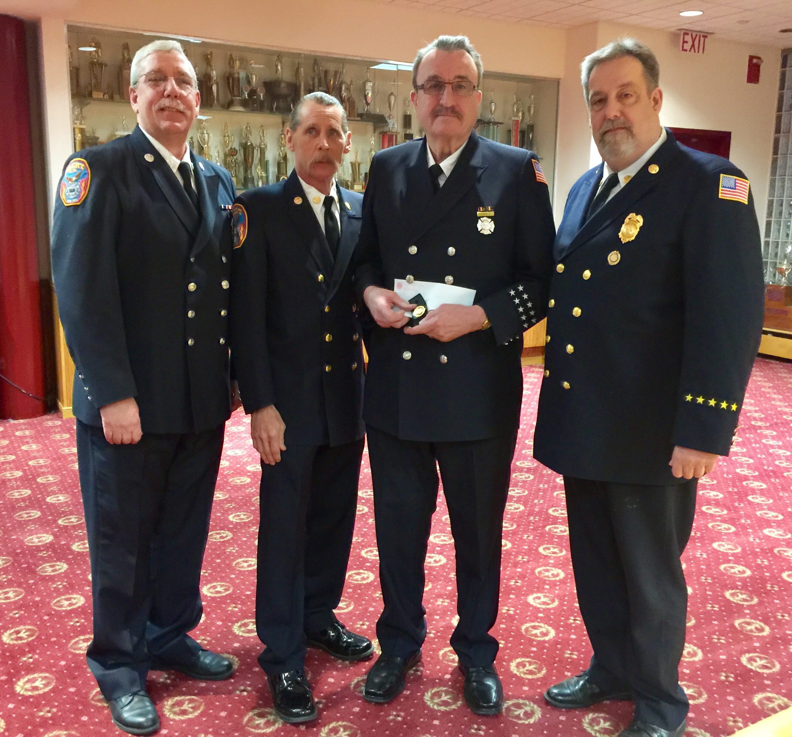 Trustee William McGirr, Chief Steve Schwartz, James Lawrence and President Michael Berry. (Photo courtesy of Great Neck Alert Fire Company)