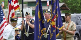 The color guard prepares to advance on Memorial Day at the East Williston Village Green. (Photo by Gretchen Keller)