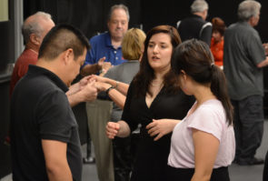 Jadis Armbruster, one of the Gold Coast Arts Center's newest teachers, reviews steps with a couple at the workshop. (Photo by Janelle Clausen)