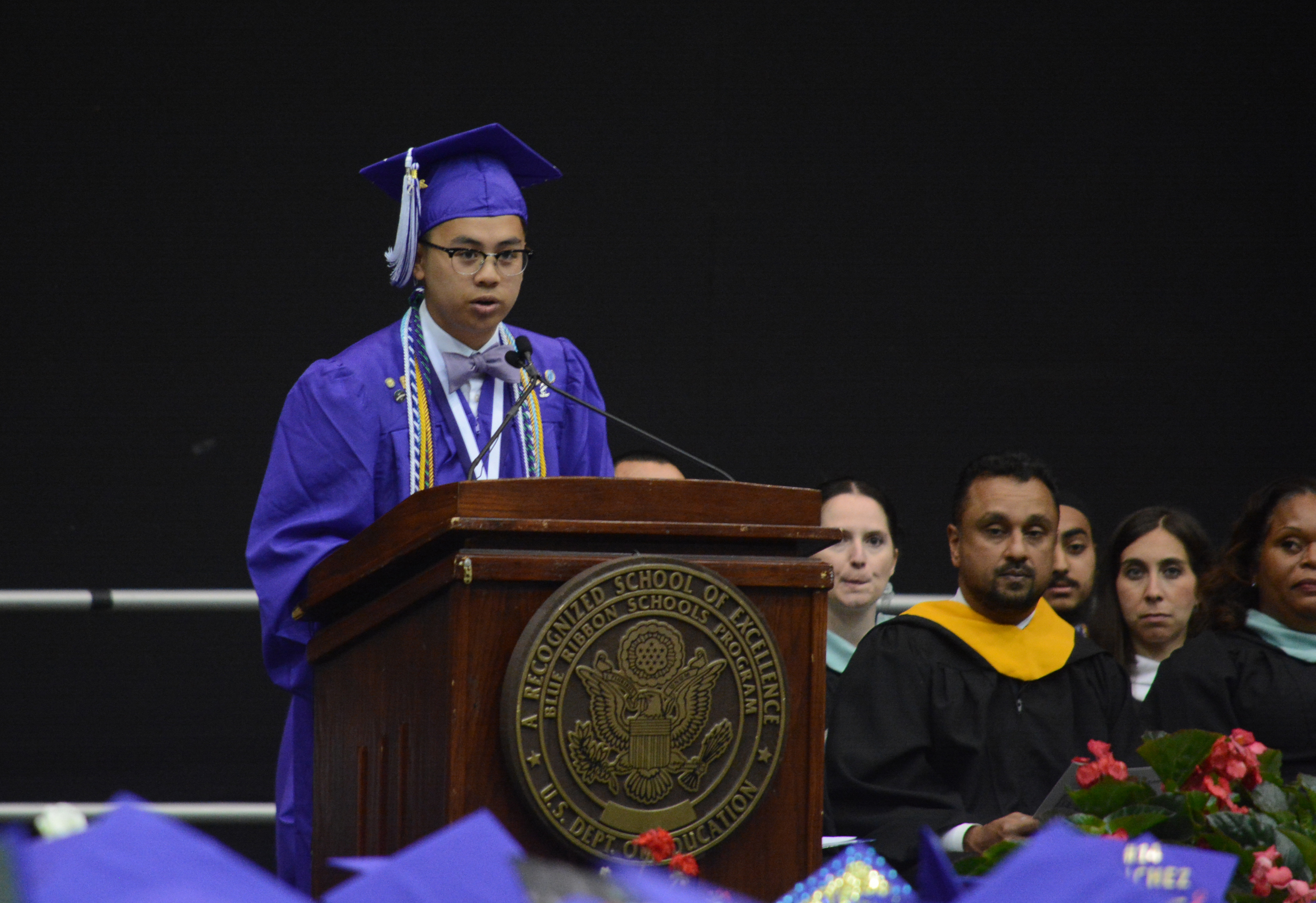 Adrian-James Gevero, the salutatorian of Sewanhaka High School's class of 2018, speaks before more than 200 colleagues and hundreds more in attendance. (Photo by Janelle Clausen)