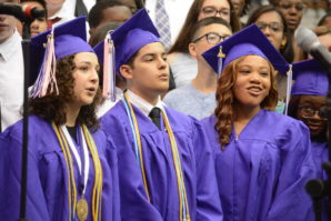 A trio of graduating seniors, along with other members of the chorus, sang two last songs together: "Stand Together" and "It's Time for Moving On." (Photo by Janelle Clausen) 