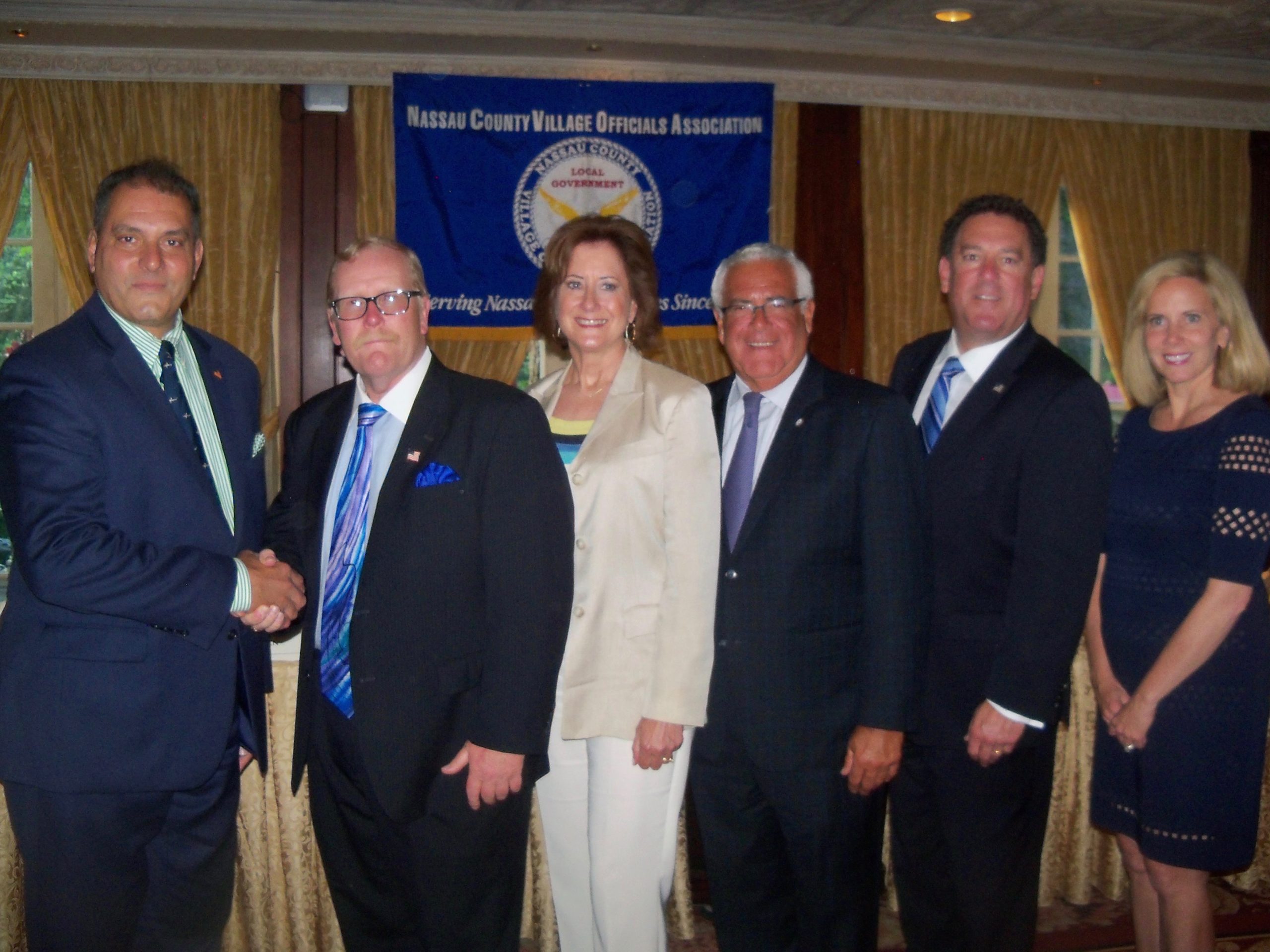 Oyster Bay Town Supervisor Joseph Saladino and Hempstead Town Supervisor Laura Gillen administered the oath of office to Mayor Celender and the NCVOA officers for 2018-2019, including President Ralph Ekstrand, mayor of the Village of Farmingdale, Mayor Celender, 2nd Vice President Edward Lieberman, mayor of the Village of Sea Cliff, and Treasurer Daniel Serota, mayor of the Village of Brookville. (Photo courtesy of NCVOA)