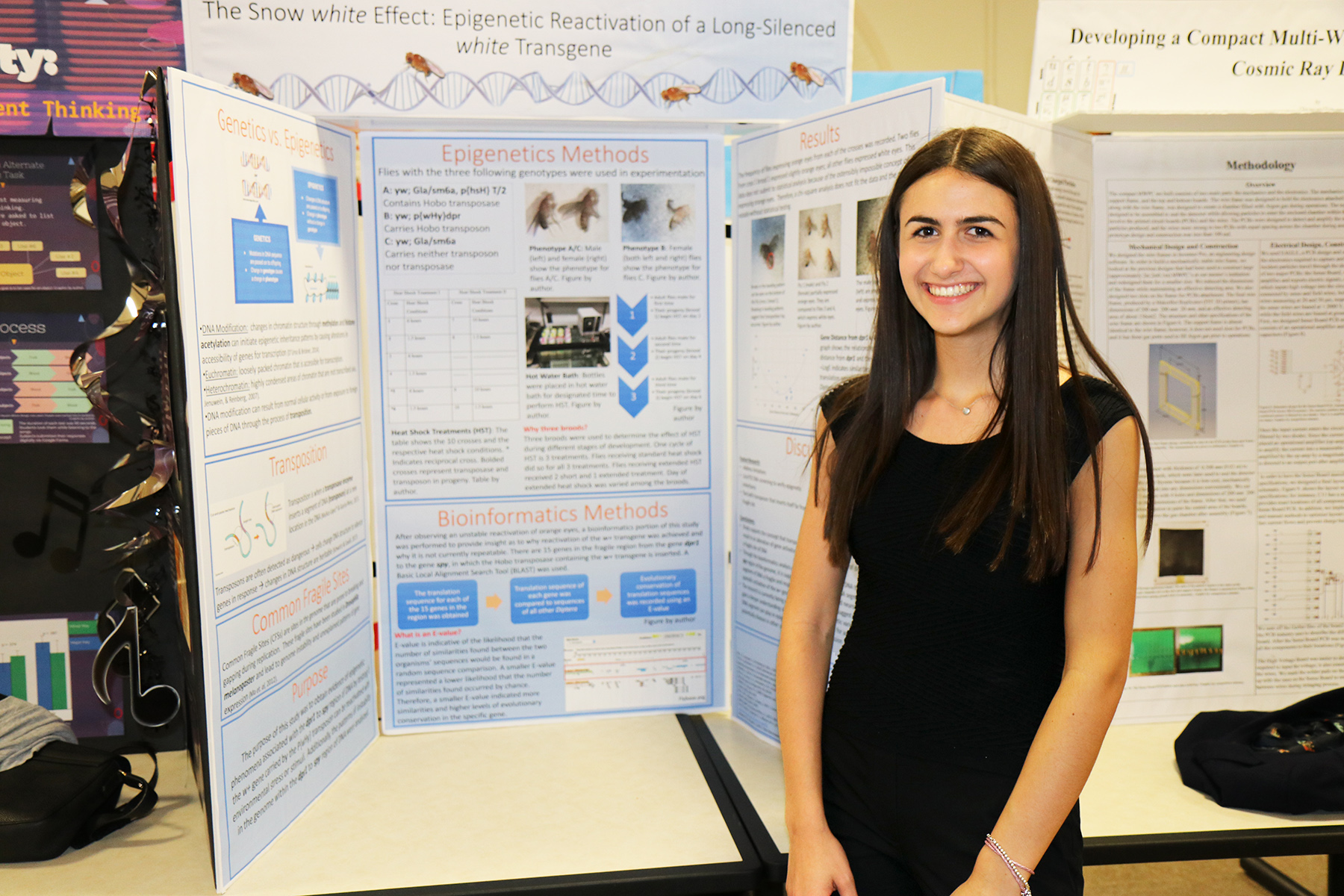 North High senior Jacqueline Slobin with her research on the genetic eye color of flies, which she conducted at St. John’s University last summer. (Photo courtesy of the Great Neck Public Schools)