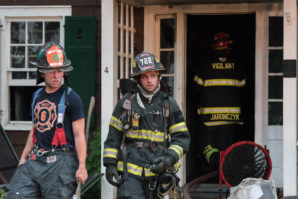 Firefighters exit the home. (Photo courtesy of Over the Edge Photography)
