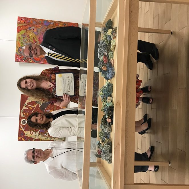 Artist Lauren Skelly Bailey, joined by Great Neck Library Art Committee Chair Pamela Levin, Great Neck Library Director Denise Corcoran and Assemblyman Anthony D'Urso, holds her citation. (Photo courtesy of Assemblyman Anthony D'Urso's office)
