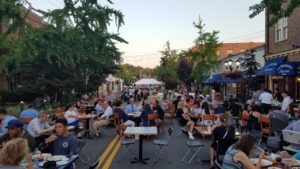 Diners sat at tables lined up along Bond Street to enjoy a meal and a night of karaoke in Great Neck Plaza. (Photo by Maylan L. Studart) 