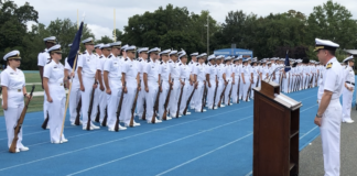 U.S. Navy Capt. Steven Urwiller speaks to the U.S. Merchant Marine Academy Class of 2022 prior to swearing them in as Midshipmen in the U.S. Navy Reserve. Urwiller spoke at the Academy’s Toom Field during Parents Weekend. (Photo courtesy of the U.S. Merchant Marine Academy)