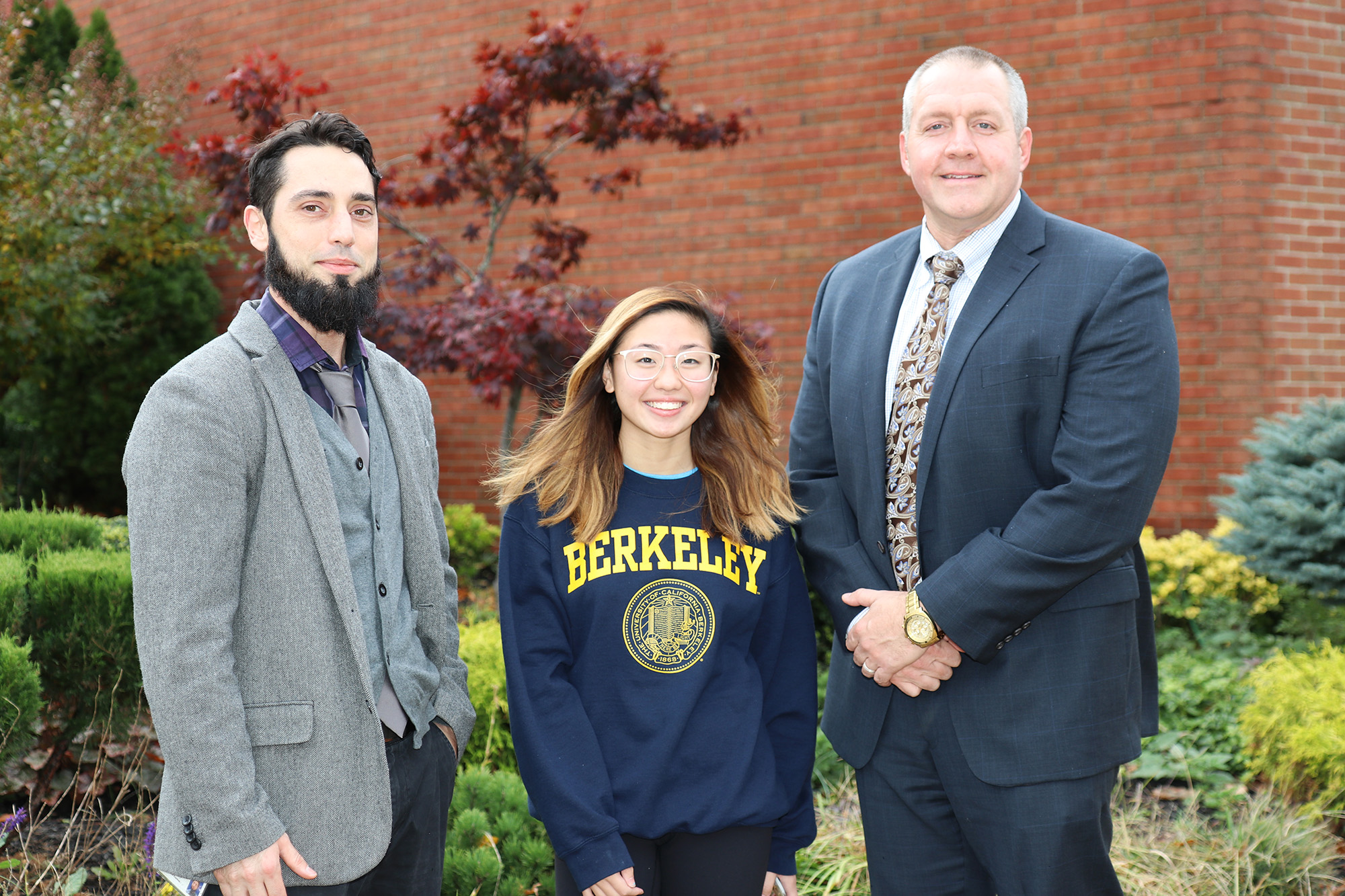 South High junior Sara Jhong is congratulated by her AP English Language and Composition teacher Michael Moran, and South High Principal Christopher Gitz. (Photo courtesy of the Great Neck Public Schools)