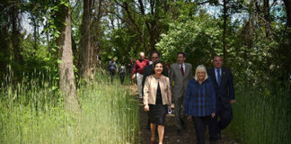Town officials walk along the Hempstead Harbor Shoreline Trail, which they hope to expand. (Photo courtesy of the Town of North Hempstead)