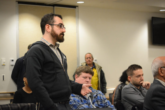 DSC_9302 Eliot Friedman, 29, speaks up about issues like healthcare and affordability at the town hall-style forum. (Photo by Janelle Clausen)