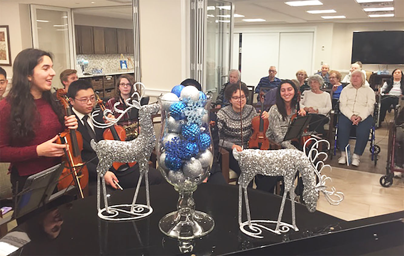 Musicians from North High School visited the Atria to perform for its residents. (Photo courtesy of the Great Neck Public Schools)