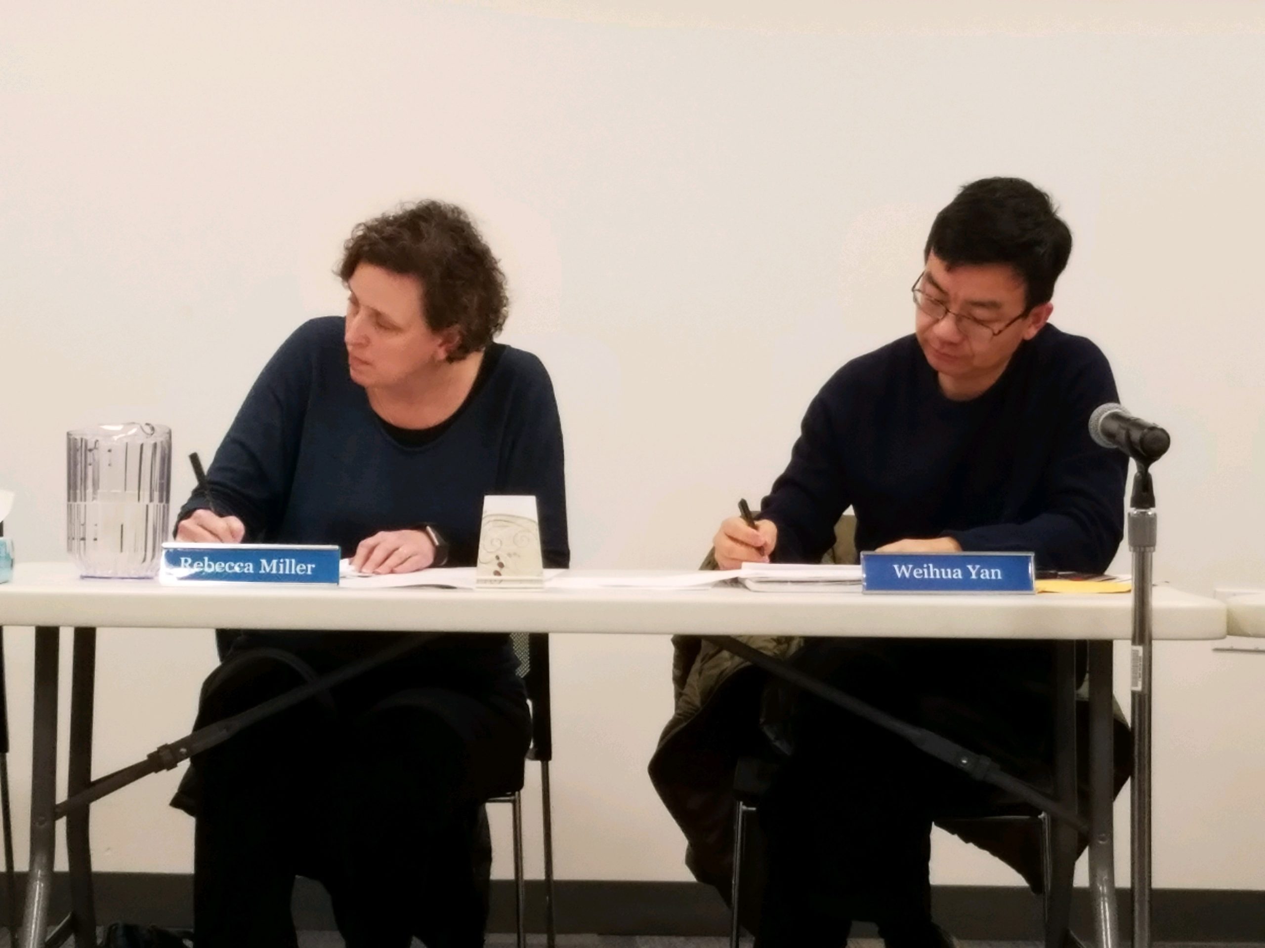 President Rebecca Miller and Vice President Weihua Yan take notes at the Great Neck Library's reorganizational meeting. (Photo by Janelle Clausen)