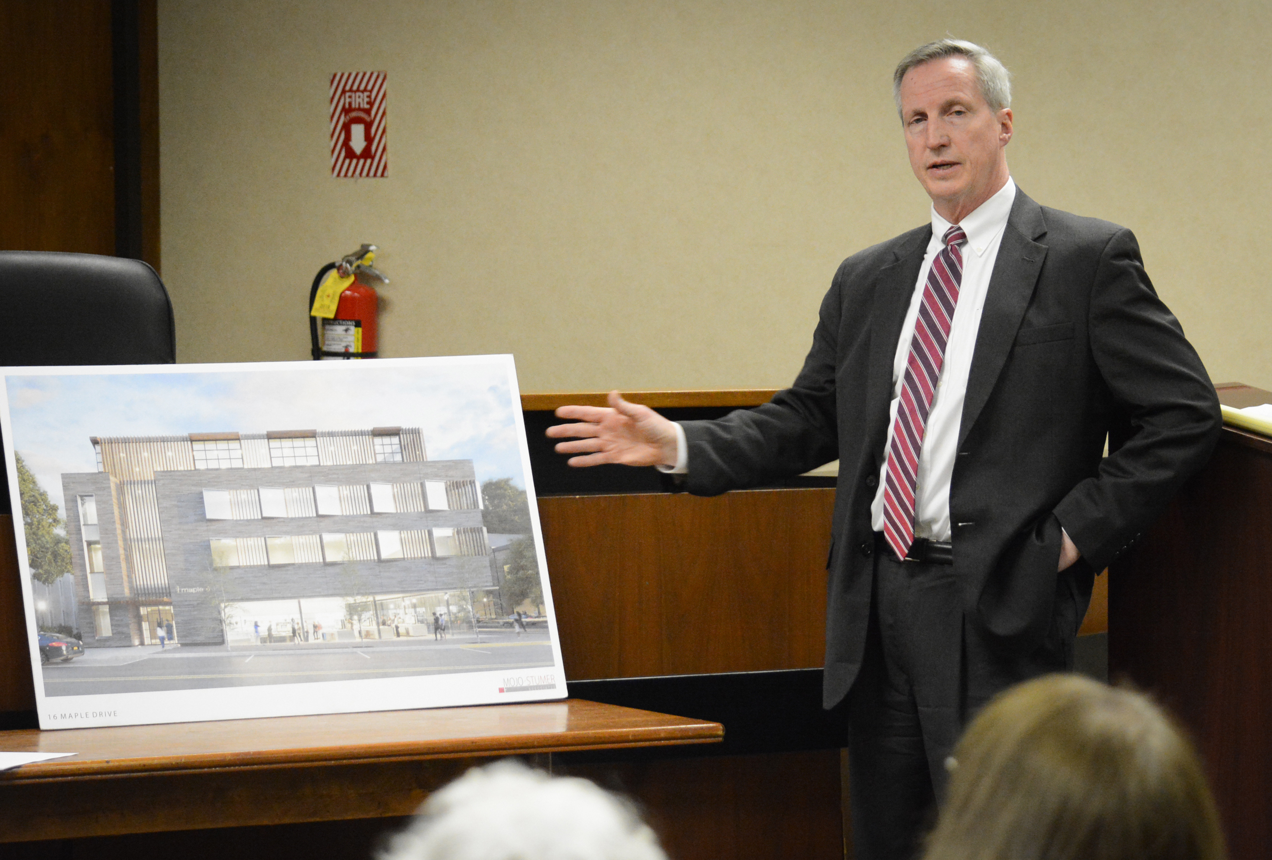 Chris Prior, a legal representative for Spiegel Associates, presents an artist's rendering of its proposed 16 Maple Drive development. (Photo by Janelle Clausen)