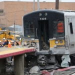 Three people were killed in a fatal crash before this LIRR train derailed and collided with the Westbury train station platform. (Photo by Janelle Clausen)