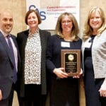 During the 2019 CAS Administrator of the Year awards ceremony, Parkville School Principal Kathleen Murray is congratulated by John F. Kennedy School Principal Ron Gimondo, Assistant Superintendent for Elementary Education Kelly Newman, and Superintendent of Schools Teresa Prendergast. (Photo courtesy of Great Neck Public Schools)