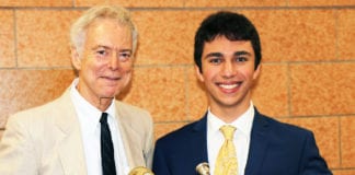 Omeed Tartak is photographed with Joseph Rutkowski, his instrumental music teacher at North High School. (Photo courtesy of the Great Neck Public Schools)