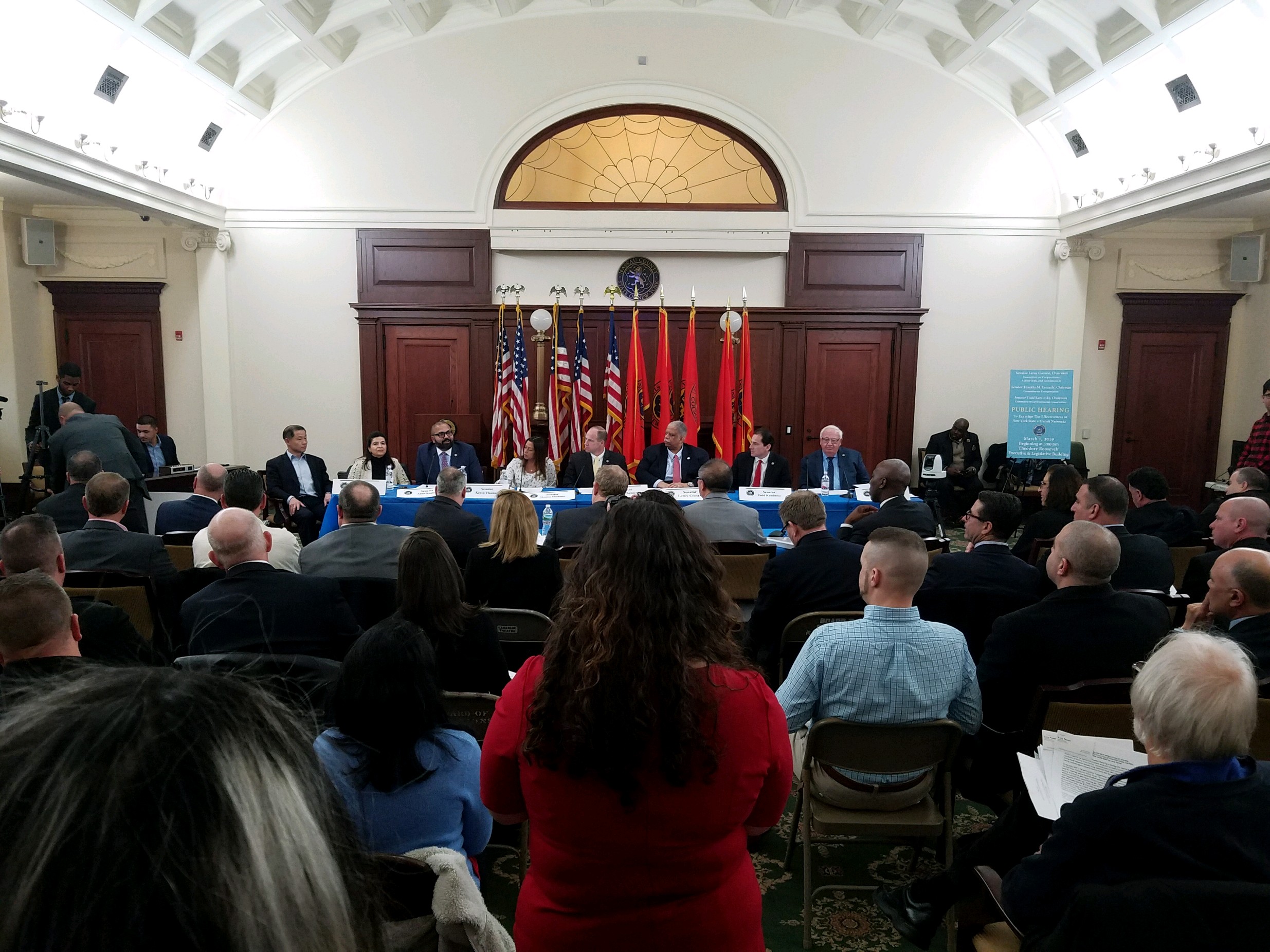 Officials, press and members of the public crowded a room in the Theodore Roosevelt Executive and Legislative Building in Mineola for a State Senate hearing on the LIRR last Friday. (Photo by Janelle Clausen)