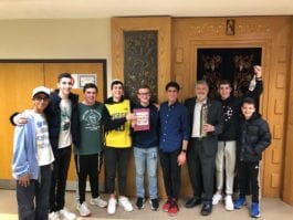 Current eighth-grader Justin Mirharoon, Noah Hutt (‘17), Ruben Prawer (‘16), Ben Zuckerman (‘17), Danny Kroll (‘16), Eric Kalimi (‘18), Megillah Instructor Paul Brody, Sammy Kroll (‘18) and current eighth-grader, Holden Applebaum were among those who chanted the Megillat Esther at Great Neck Synagogue. Not pictured are Ben and Michael Pagovich, classes of 2015 and 2018, respectively. (Photo by Glenn Zuckerman)