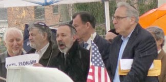 Rabbi Dale Polakoff of Great Neck Synagogue addressing attendees at an anti-semitism rally on Saturday with other speakers, including Rep. Tom Suozzi, a Democrat from Glen Cove. (Photo by Karen Rubin)