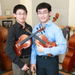 Mark Xu and Matthew Xu, both juniors at North High School, were selected to perform with the 2019 Honor Orchestra of America. (Photo courtesy of the Great Neck Public Schools)