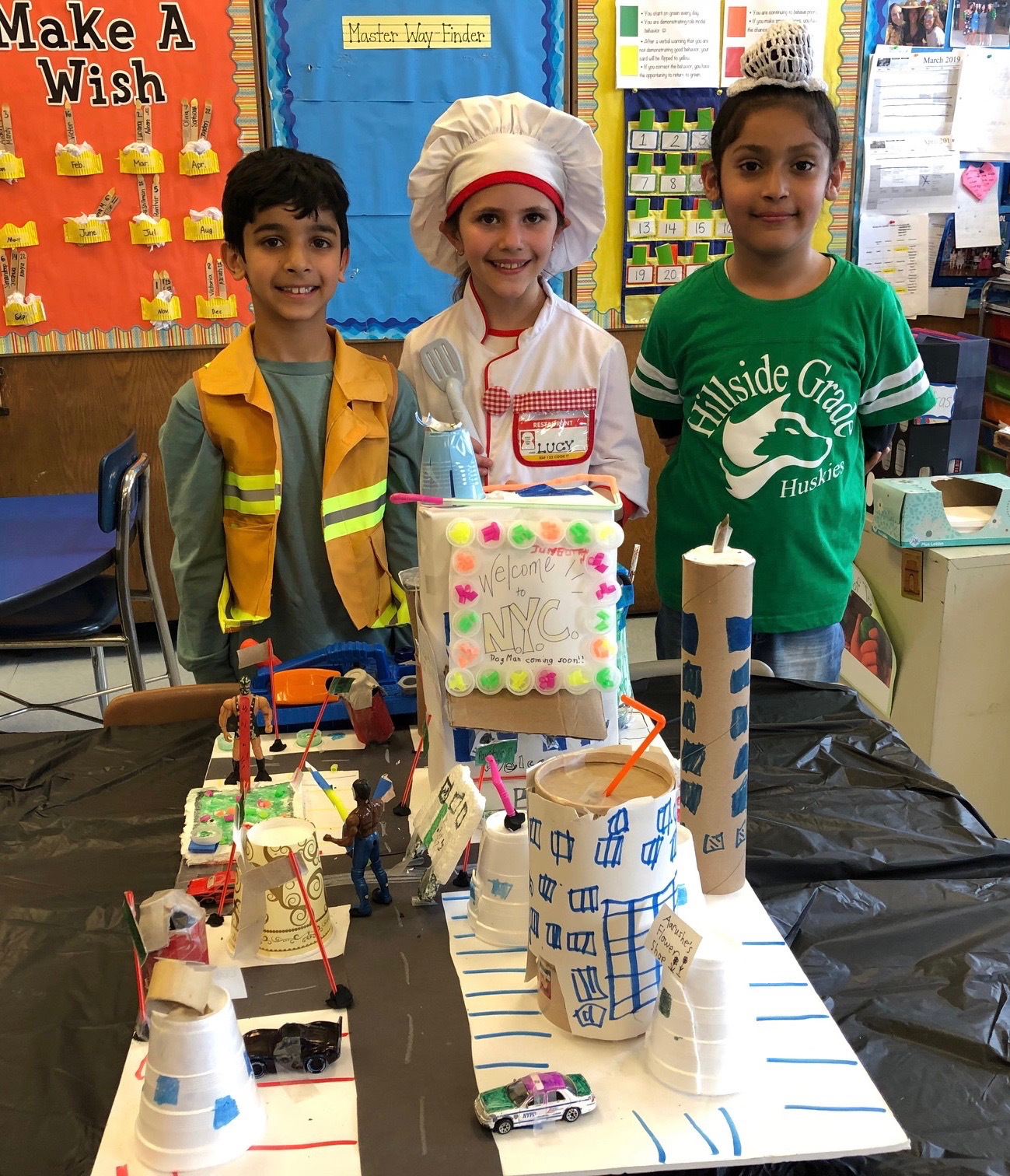 Hillside Grade School students Aarush Chowdhery, Lucy DeBartolo and Pavitvir Parmar are pictured with their 3D replica of a community. (Photo courtesy of New Hyde Park-Garden City Park School District)