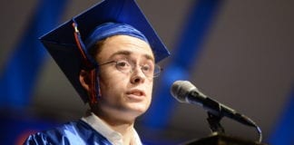 David Carbone, the "voice of Great Neck South High School," took a moment to honor the legacy of the late Sally Passarella, who he said changed his life, at commencement. (Photo by Janelle Clausen)