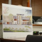 A rendering of the proposed recreational center for the United Mashadi Jewish Community of America sits in front of the Village of Great Neck Board of Trustees. (Photo by Janelle Clausen)