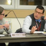 North Shore Superintendent of Schools Peter Giarrizzo speaks with Sara Jones, the school board president, during a business meeting about the impact of a possible settlement between LIPA and Nassau County. (Photo by Janelle Clausen)