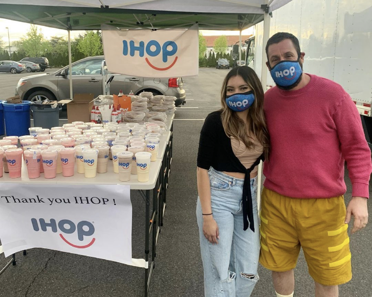 Manhasset IHOP hostess Dayanna Rodas, left, with comedian Adam Sandler. The comedy star's reaction to Rodas' viral TikTok about not recognizing him in the restaurant inspired "Milkshake Monday" at chain locations throughout the country. (Photo via Instagram)