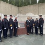 Nassau County Executive Laura Curran and fire officials pose alongside the newly unveiled First Responders Memorial. (Photo by Brandon Duffy)