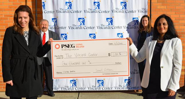 PSEG Long Island employees make donation to The Viscardi Center in Albertson